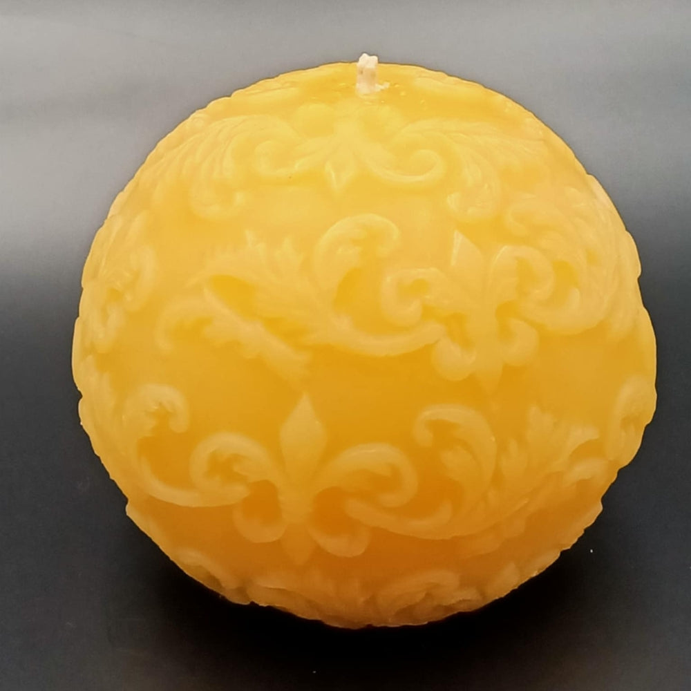 Hand-poured pure Australian beeswax Fleur de Lis ball candle with scrollwork detail by Suz E Bee Candles, Port Stephens NSW
