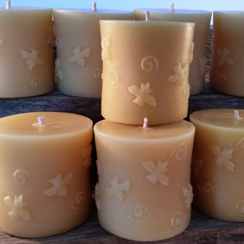 Close-up of bees moulded into hand-poured beeswax buzzing bee pillar candle — Suz E Bee Candles